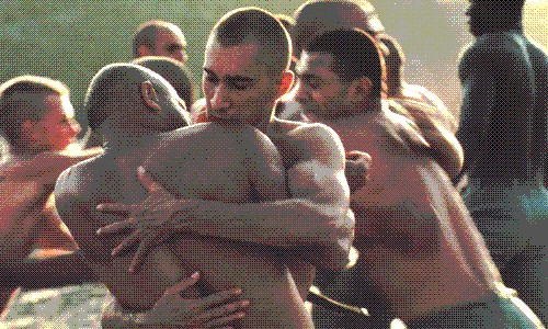 French Foreign Legion soldiers embrace in a still from Beau Travail.