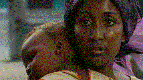 A woman cradles her baby in this still from Sambizanga.